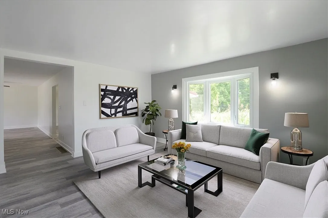 Living room featuring wood finished floors and baseboards