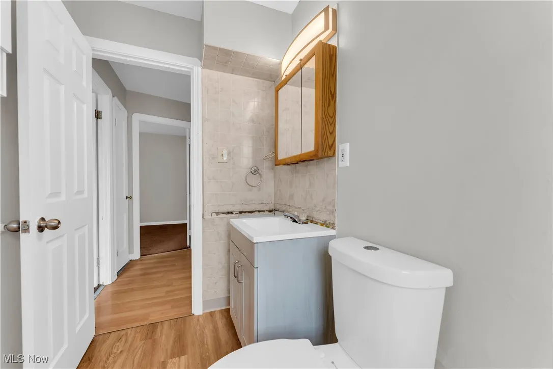 Bathroom featuring vanity and wood finished floors