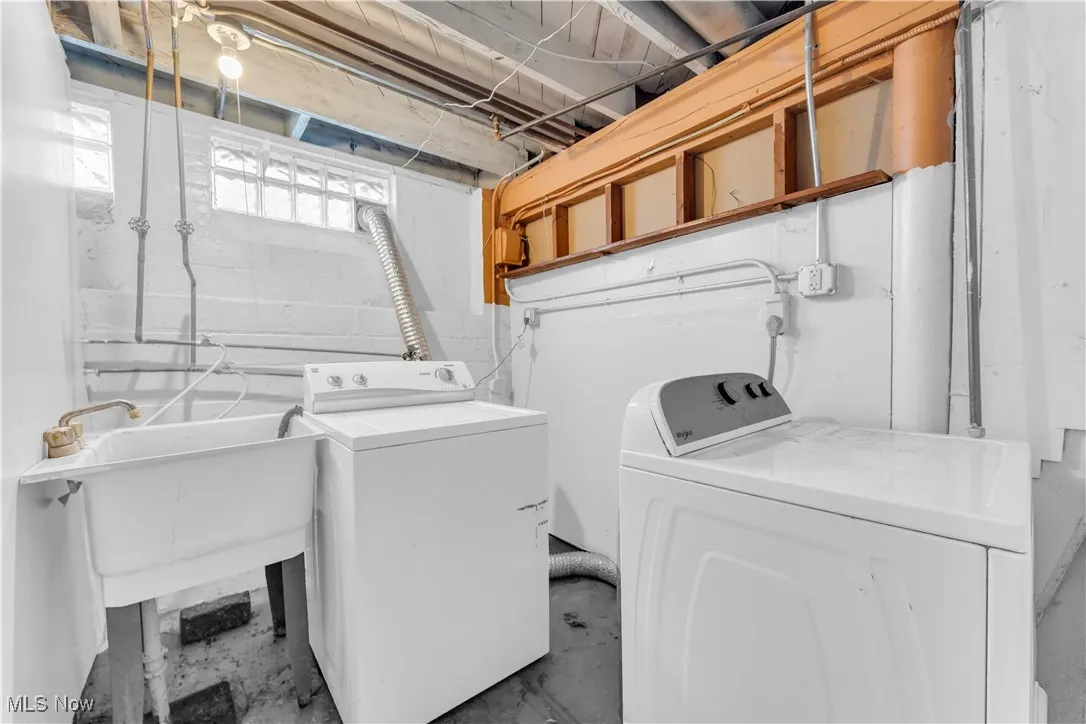 Washroom featuring washing machine and clothes dryer