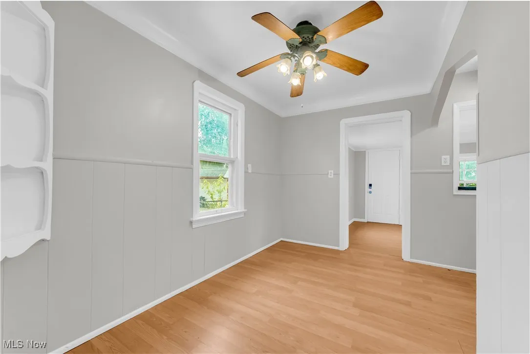 Spare room featuring light wood finished floors and ceiling fan