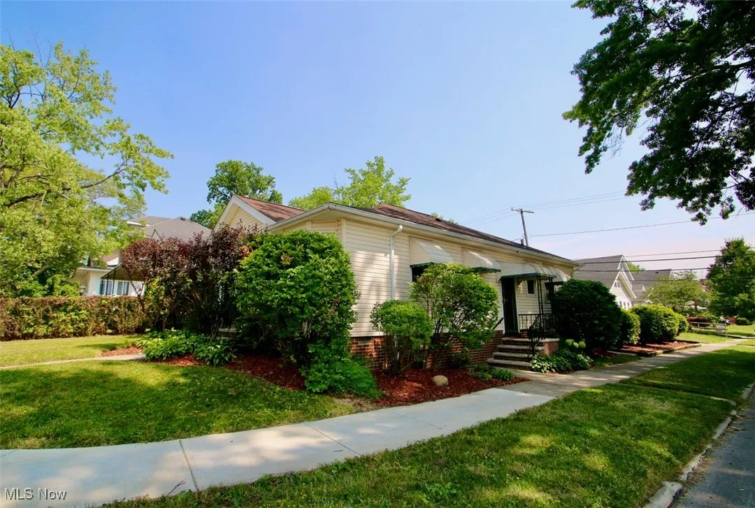 View of front of property with a front yard