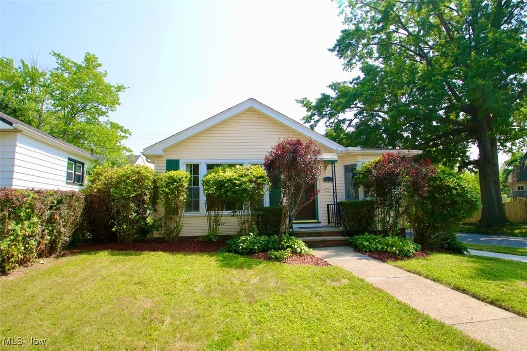 View of front of house with a front yard