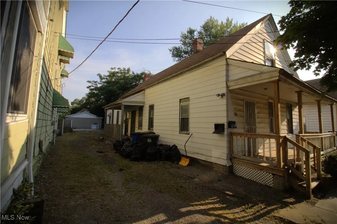 View of property exterior featuring a chimney