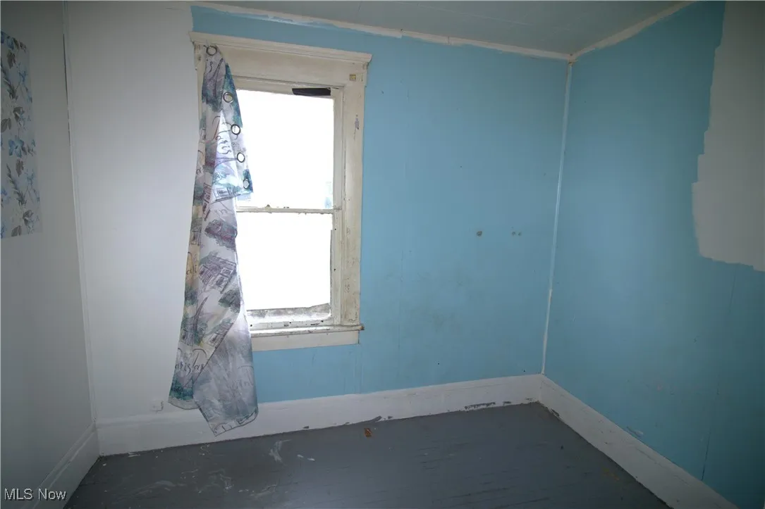 Spare room with baseboards