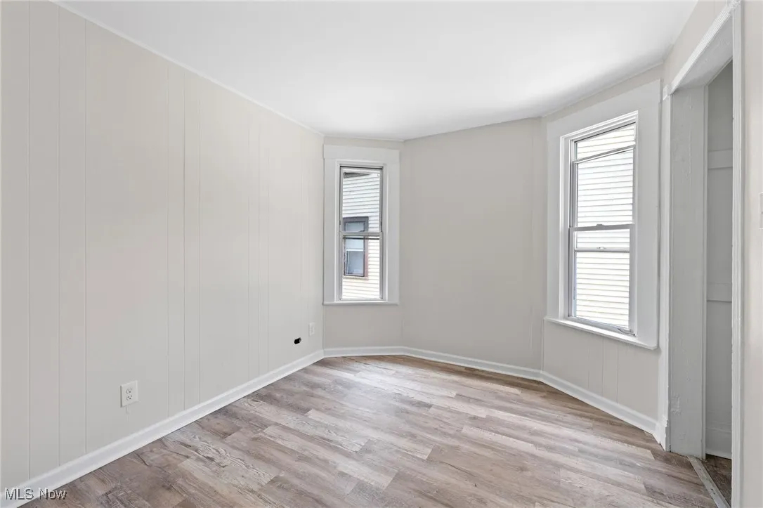 Bedroom featuring light style flooring and plenty of natural light
