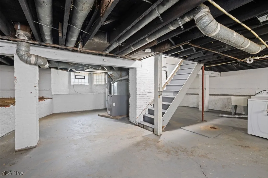 Basement with washer / clothes dryer