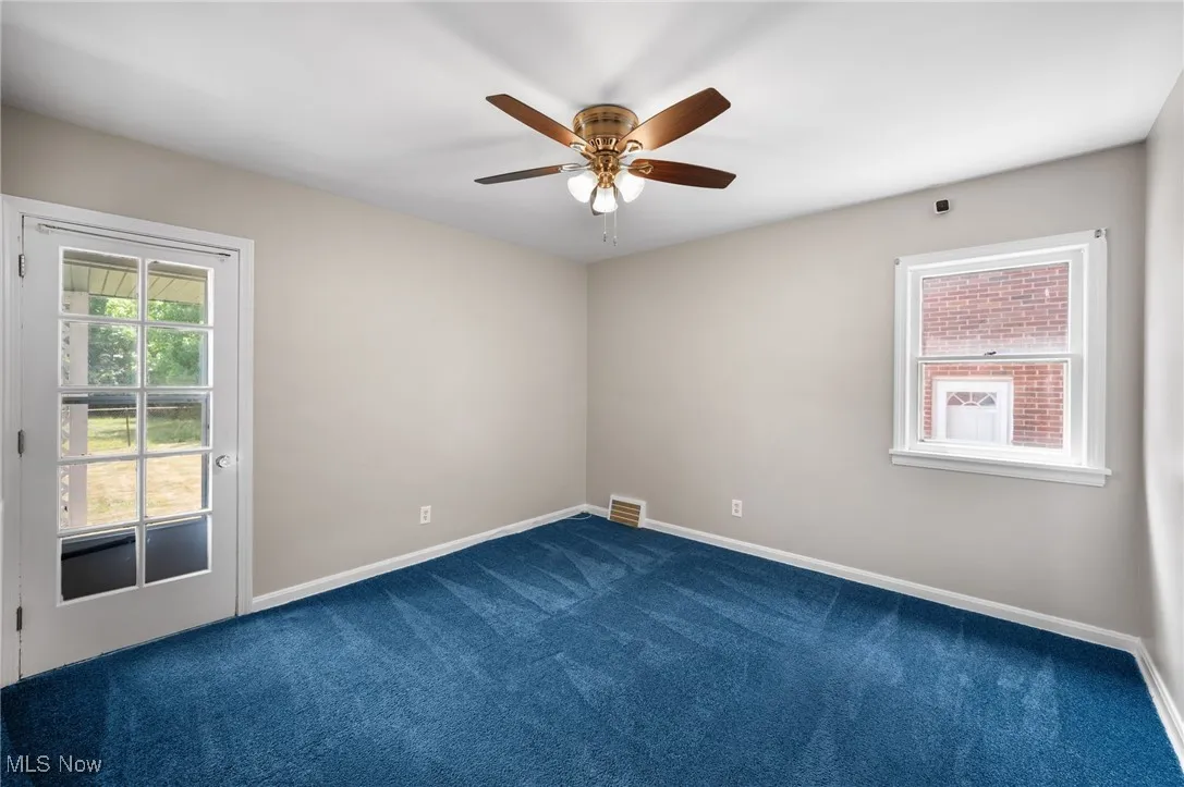 Bedroom with carpet and ceiling fan