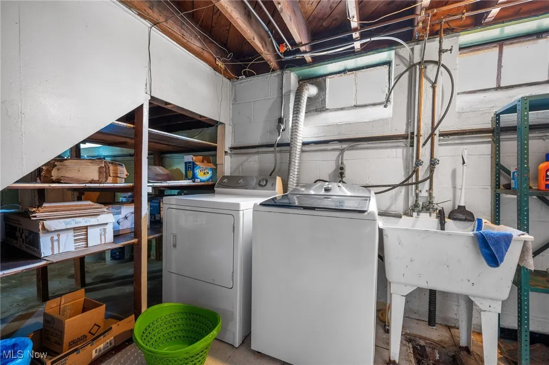 Laundry room featuring washing machine and clothes dryer