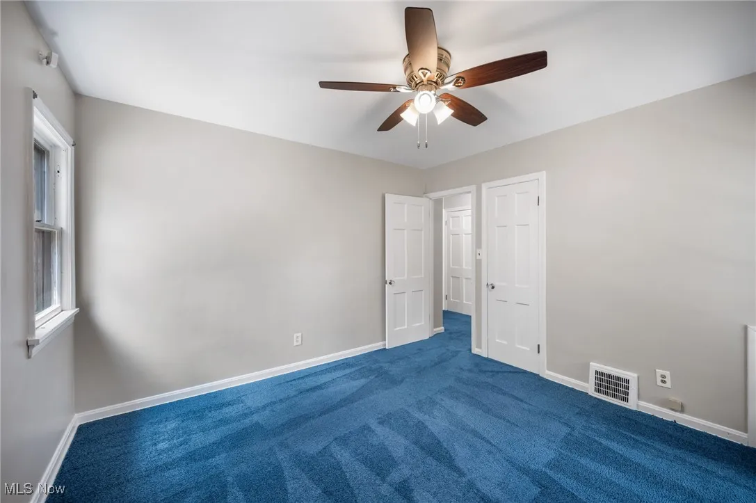 Bedroom with carpet flooring and ceiling fan