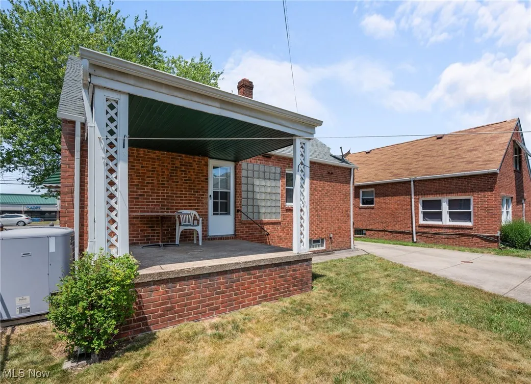 Back of house with covered porch