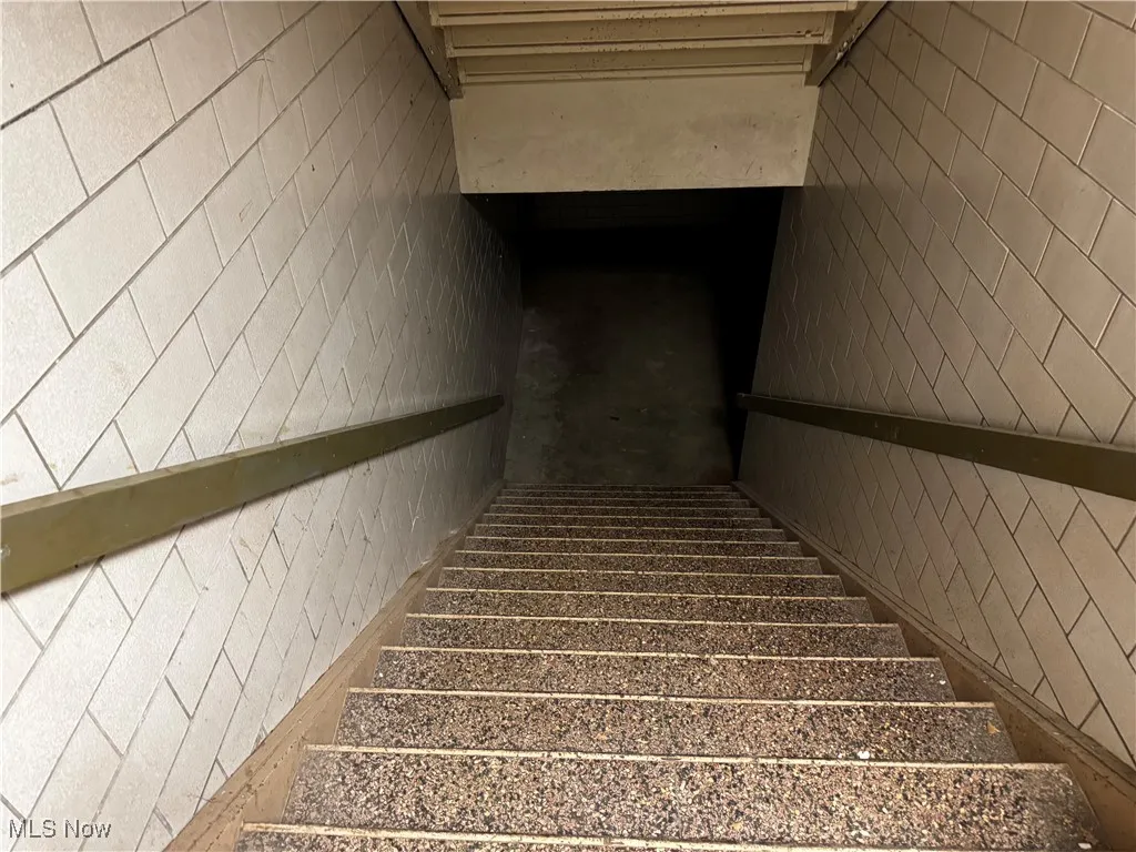 Staircase featuring a sauna / steam room
