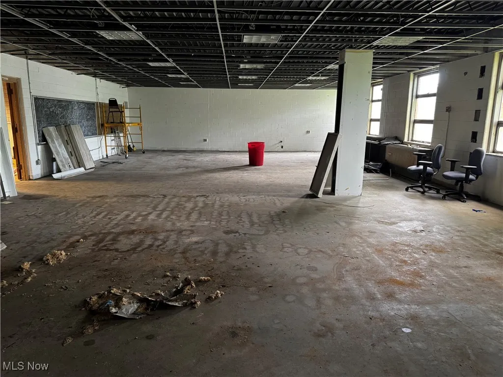 Miscellaneous room with unfinished concrete flooring