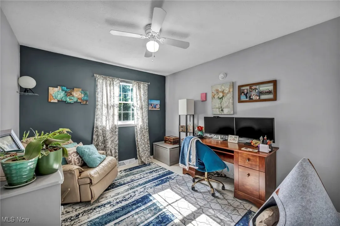 Office space featuring a ceiling fan