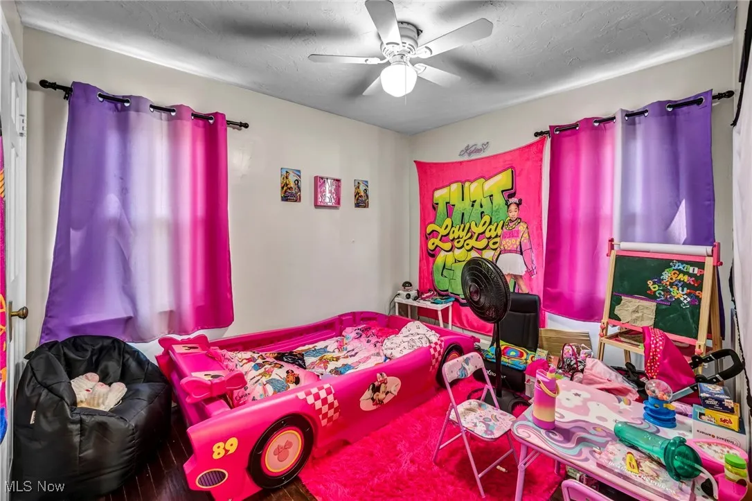 Bedroom featuring a ceiling fan