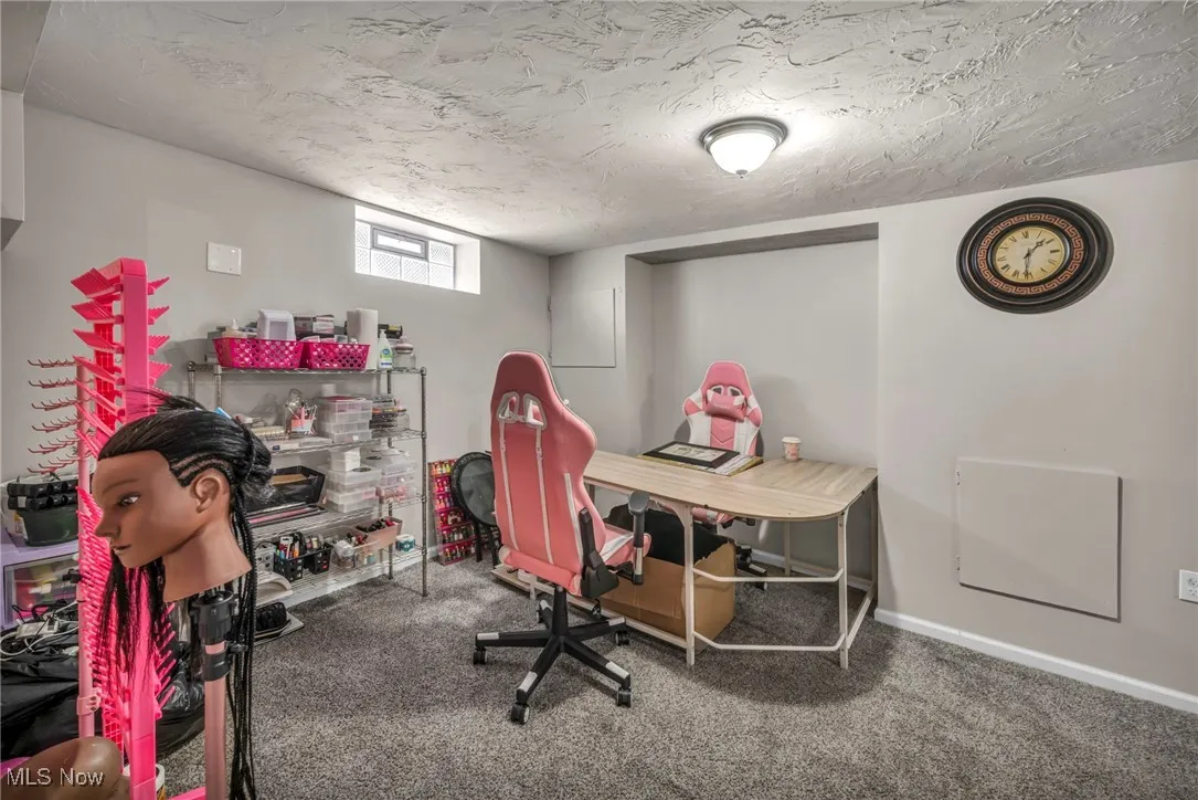 Home office featuring carpet