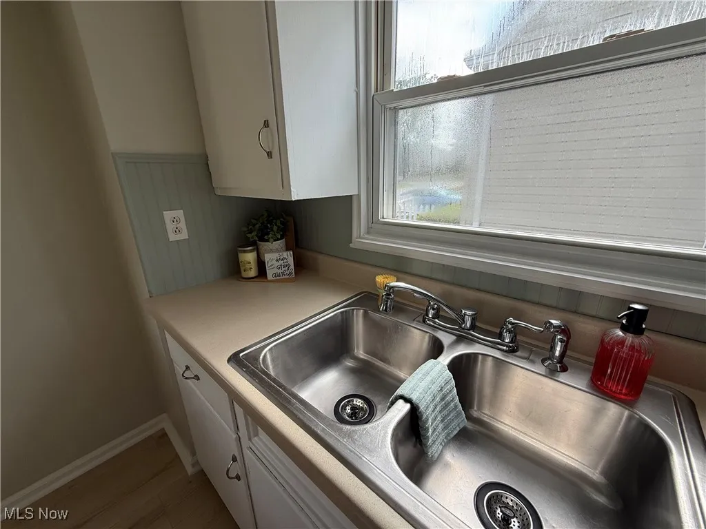 Kitchen view of light countertops and white cabinets