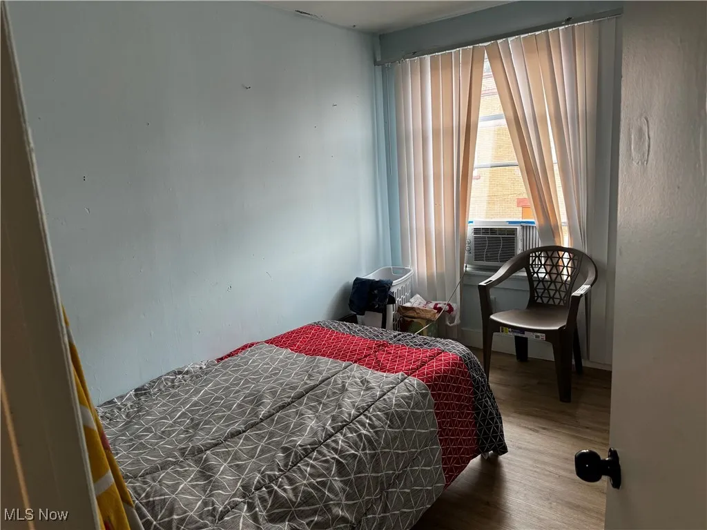 Bedroom featuring wood finished floors