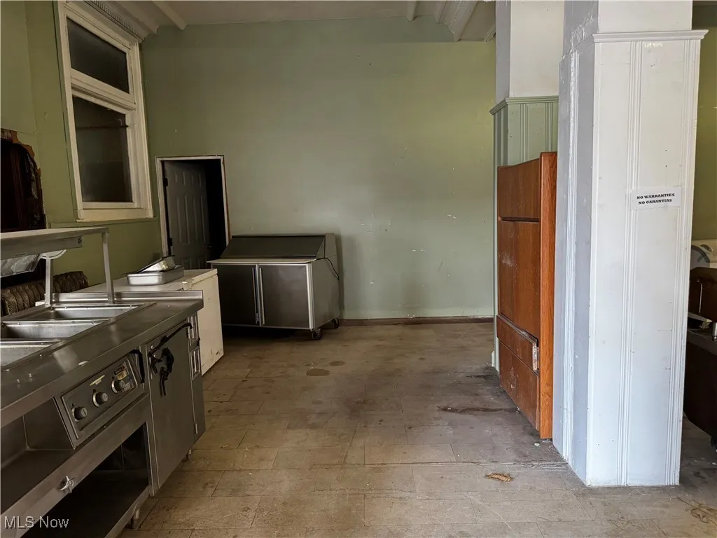 Kitchen featuring oven and a sink