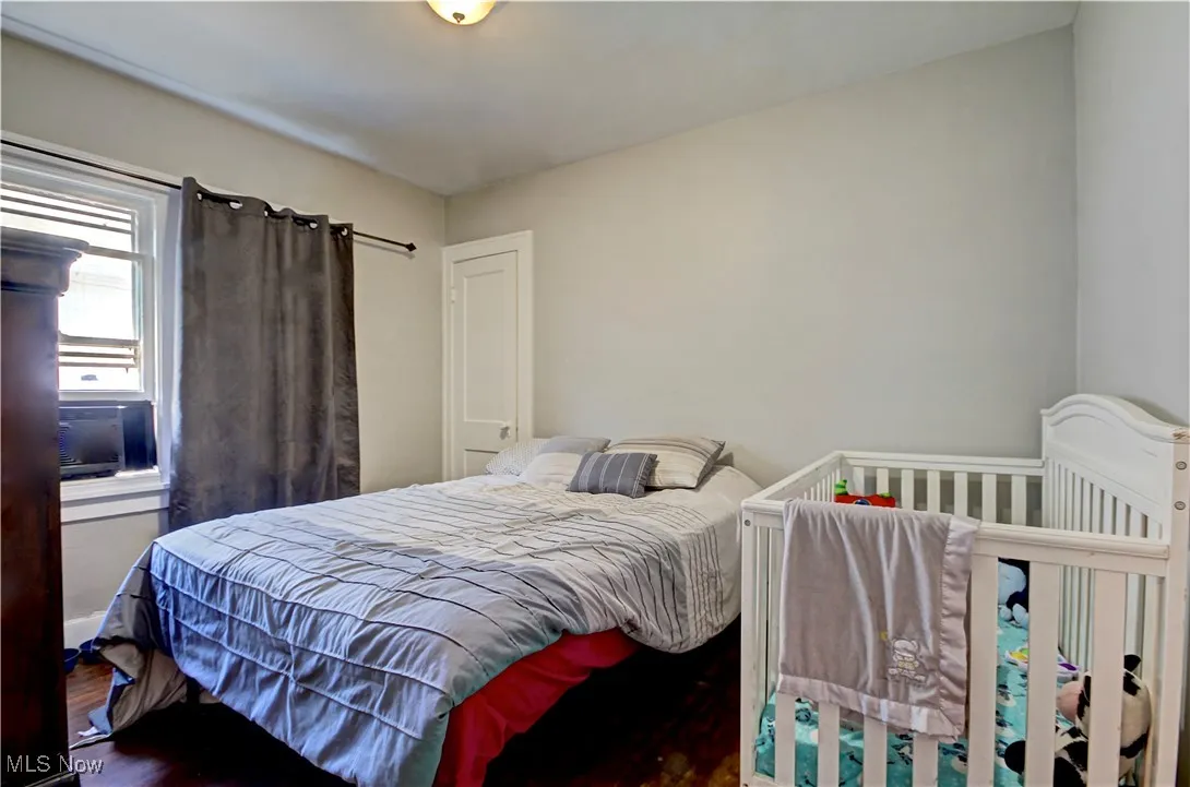 Bedroom with wood finished floors