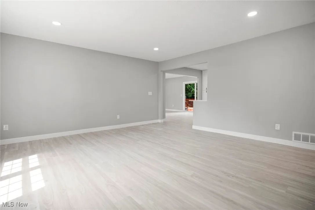 Unfurnished room featuring light wood-style flooring and recessed lighting