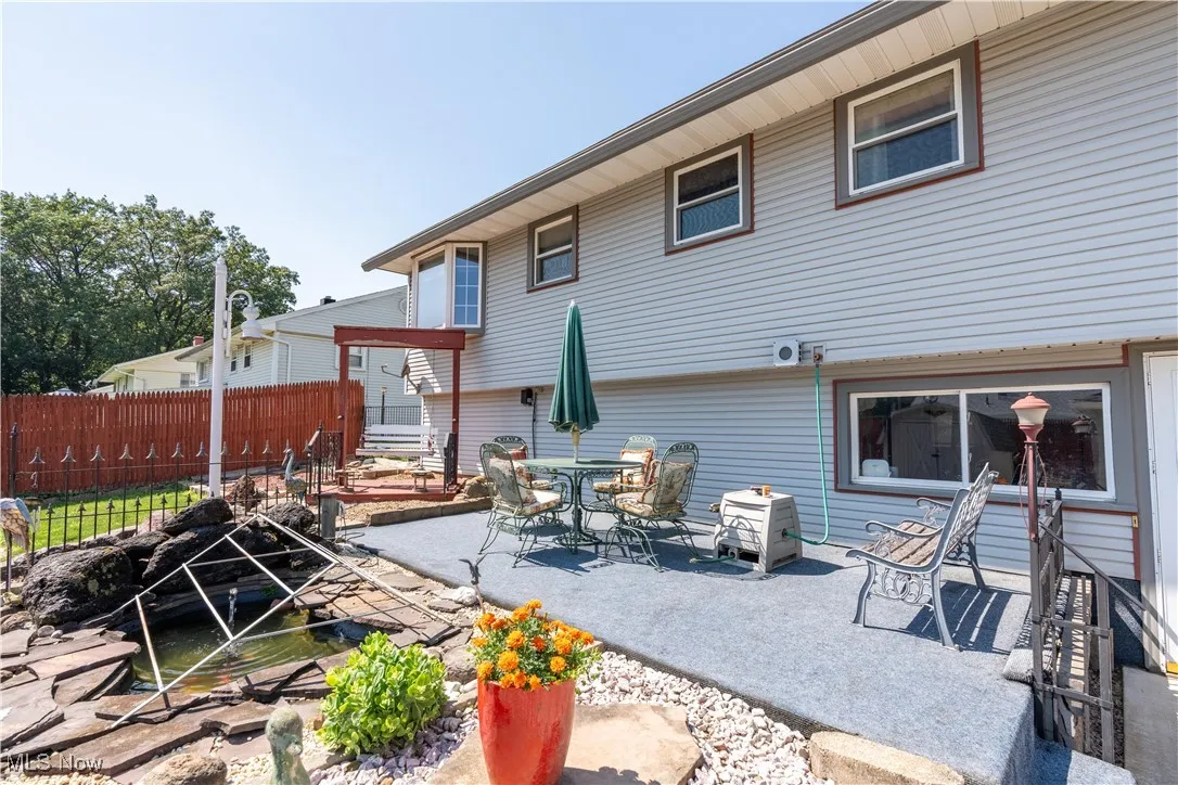 Rear view of property featuring a patio