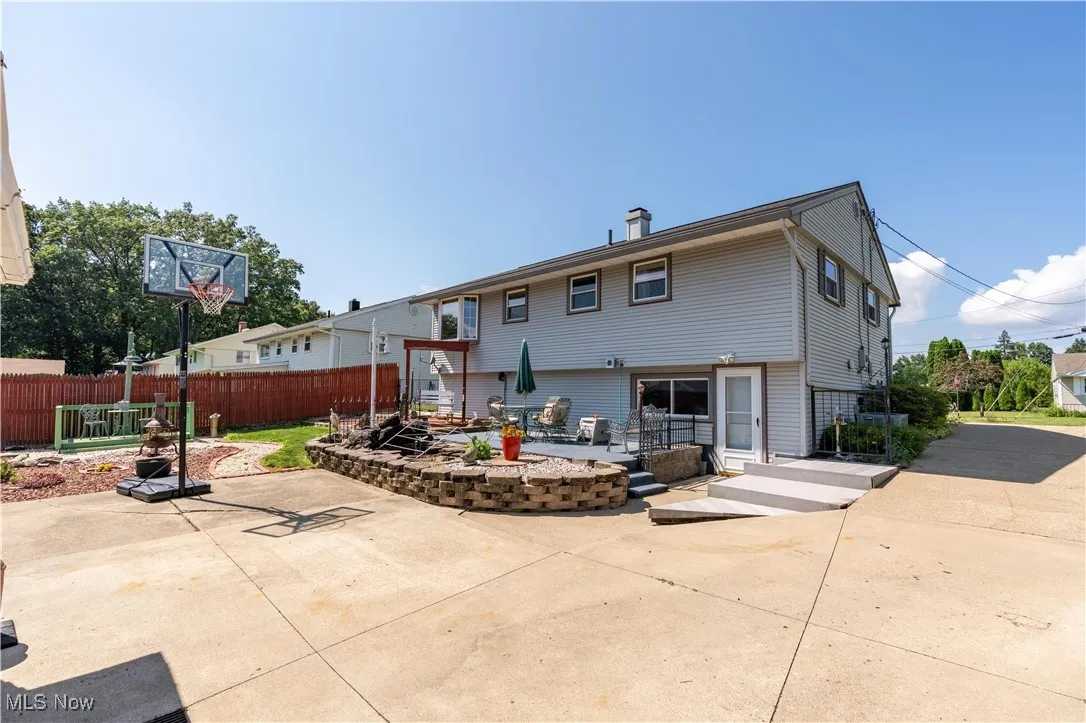 Rear view of property featuring a patio area