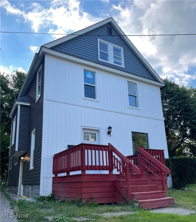 Front of property with a wooden deck