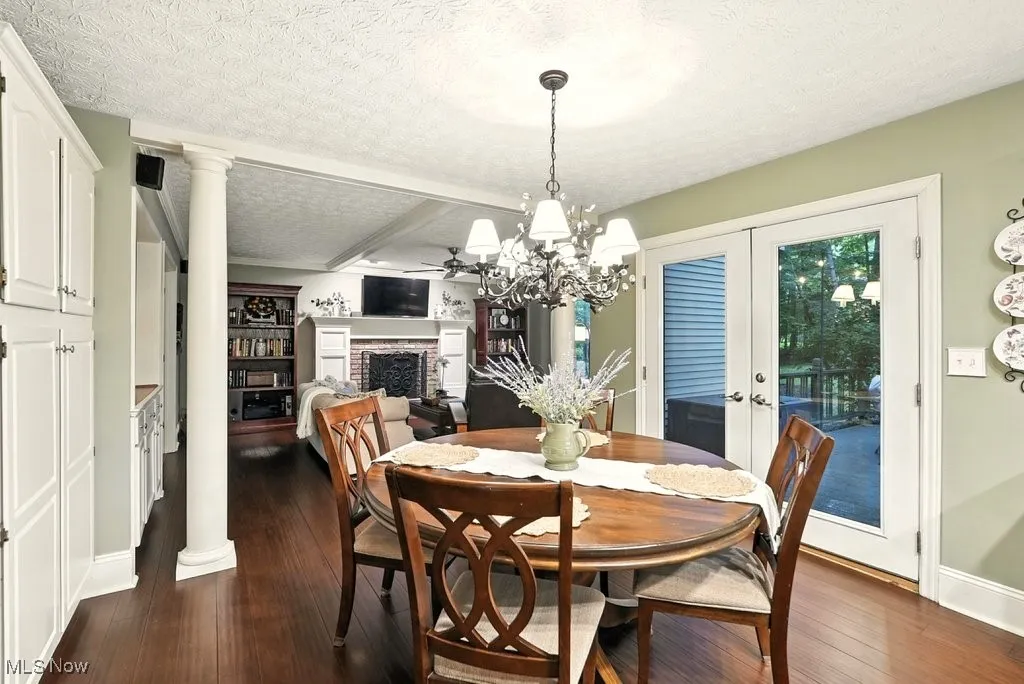 Eat-in Kitchen with Granite Counters, Subway Backsplash, Gas Cooktop, Double Oven, Updated Kitchen Cabinets, Island with a Stove Top, and Extra Wide Baseboards