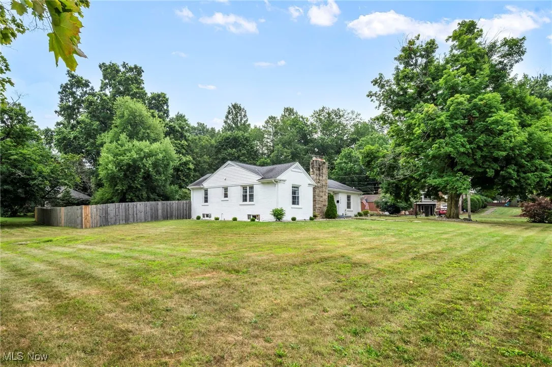 View of yard with view of wooded area