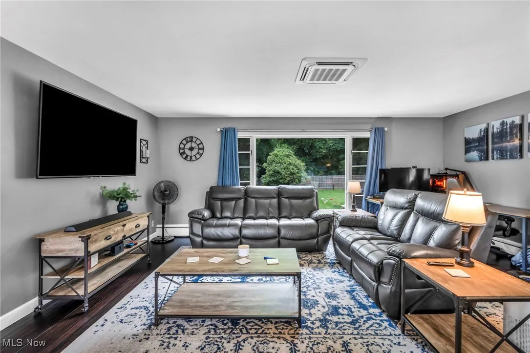 Living room featuring baseboards and wood finished floors