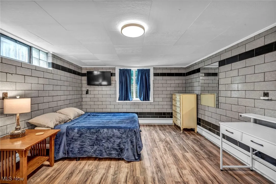 Bedroom with wood finished floors