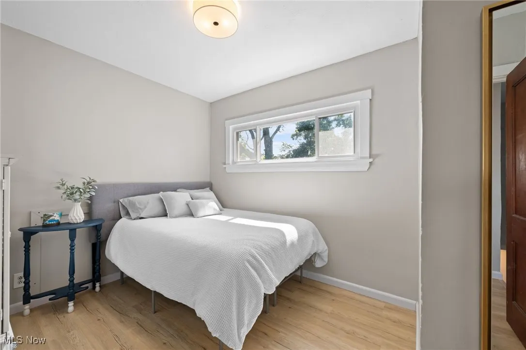 Owner's bedroom with wood style floors
