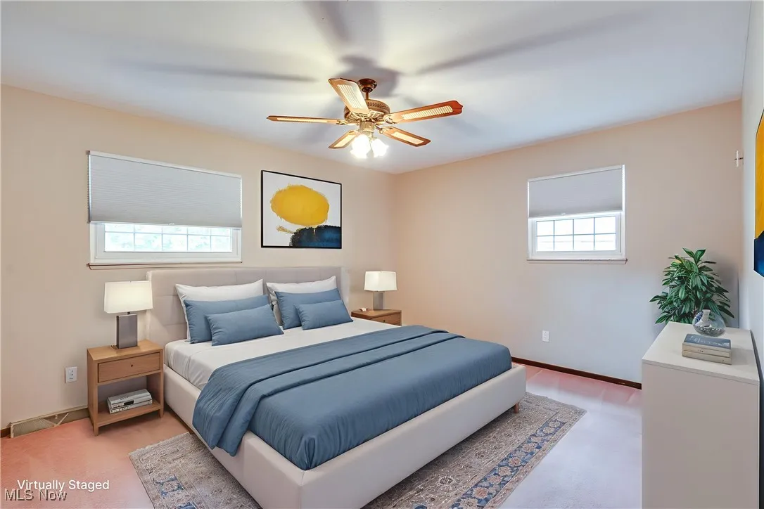 Bedroom featuring baseboards and ceiling fan