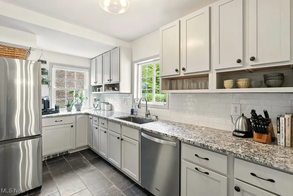 Granite countertops, deep sink, new fixtures, customized cabinets