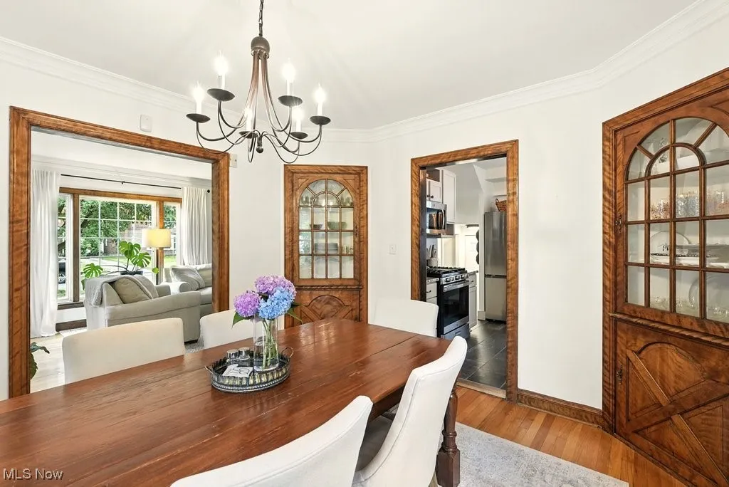 Side view of dining area with view into living room and kitchen