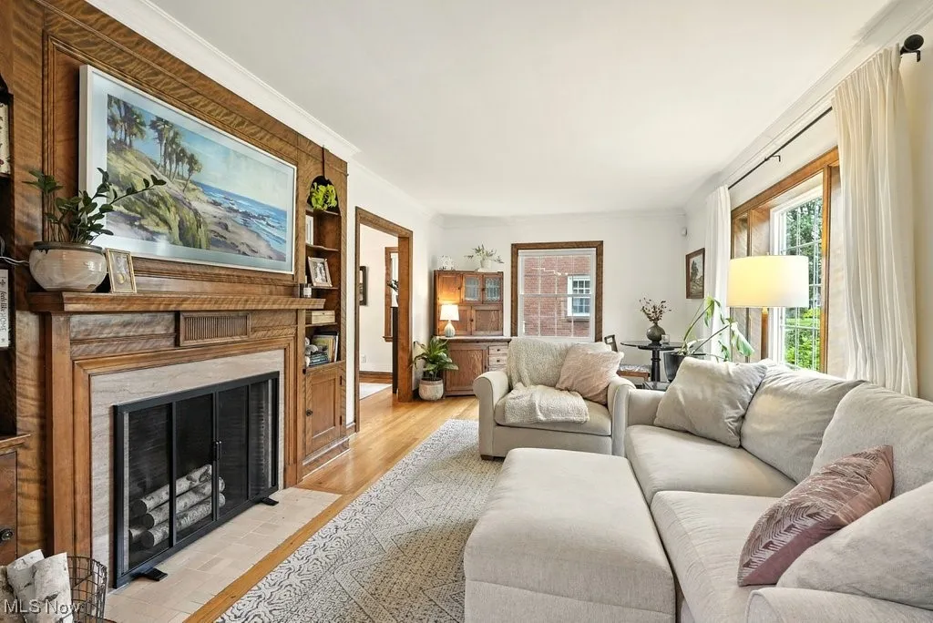 Living room with hard wood flooring, wood burning fireplace