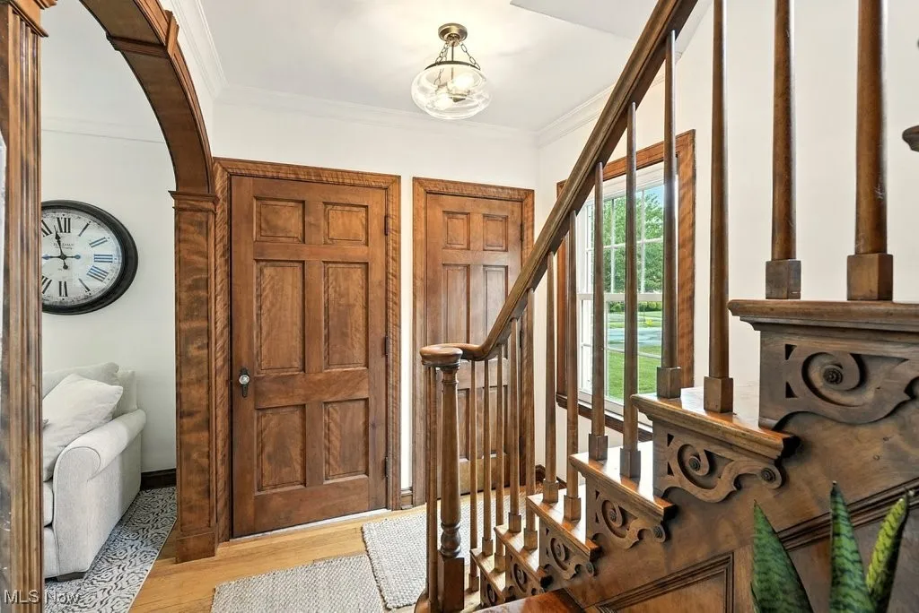 Foyer area with view of front door entry area (double front doors) and closet.