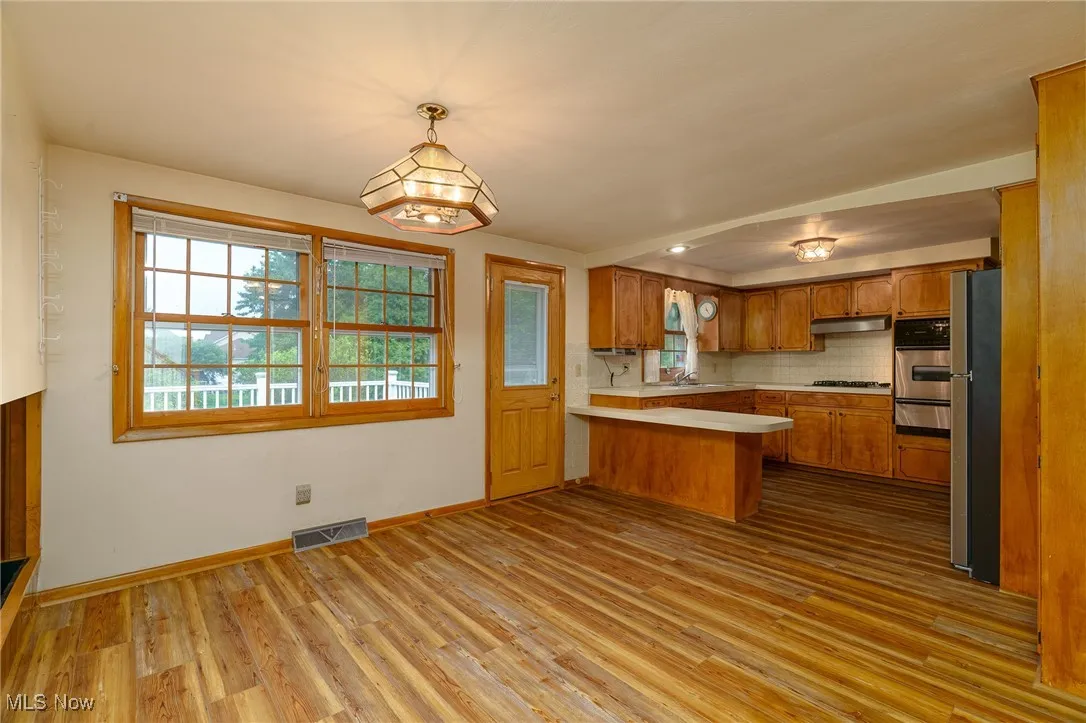 Eating area flows to a composite deck and patio.