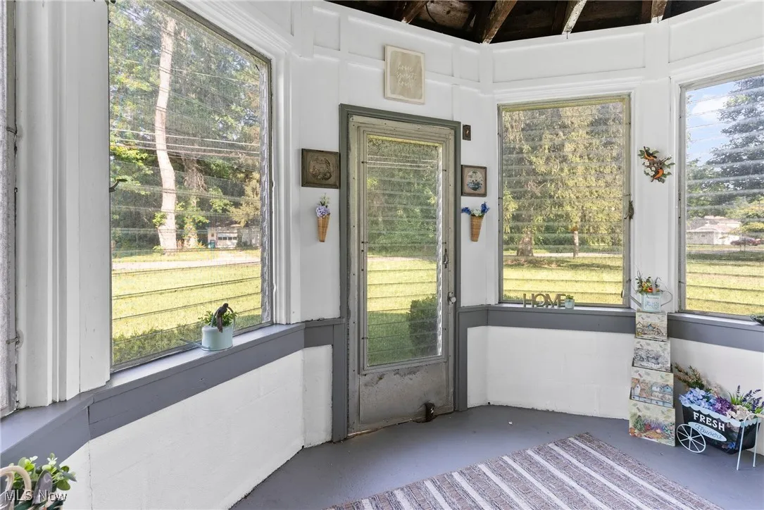 Sunroom featuring plenty of natural light
