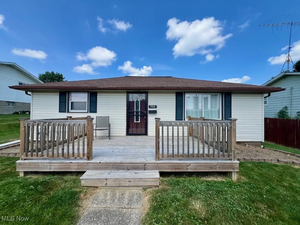 Front
 of house with a wooden deck