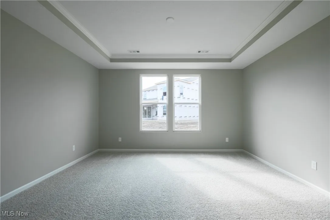 Spacious owner's suite with large windows.