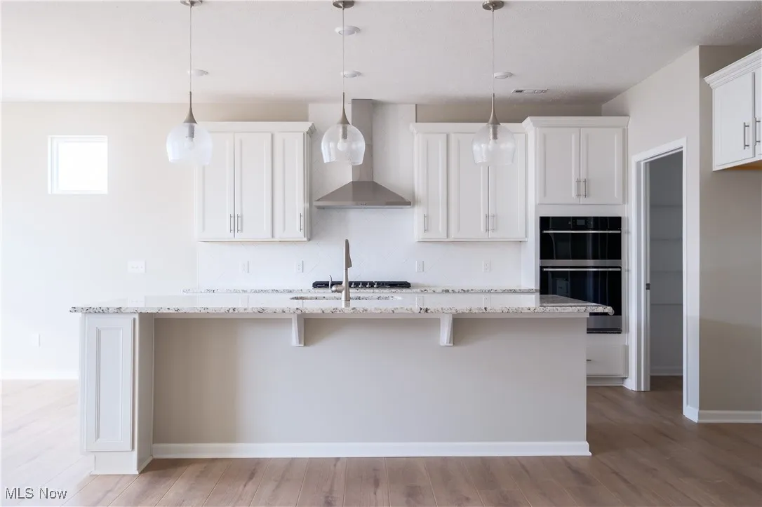 Upgraded white maple cabinetry and built-in appliances.