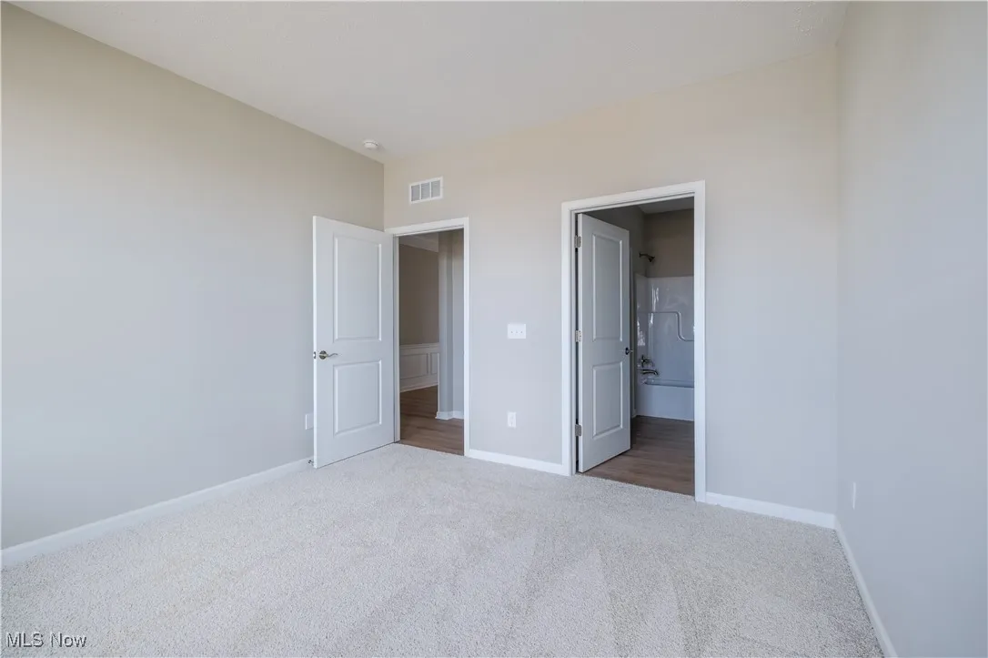 Main-level guest suite, complete with en-suite bathroom.