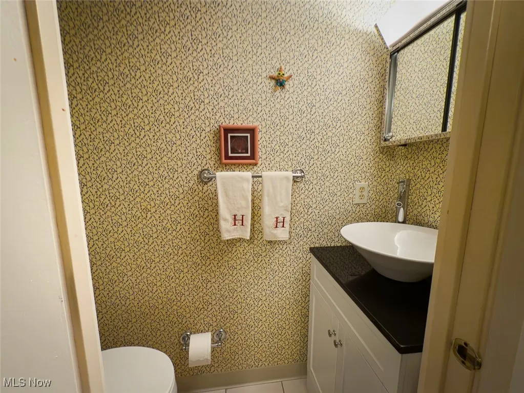 Half bath with vanity and toilet