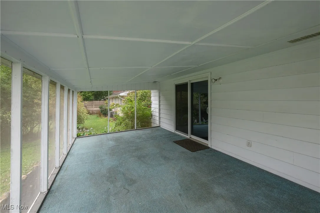 Unfurnished sunroom with healthy amount of natural light