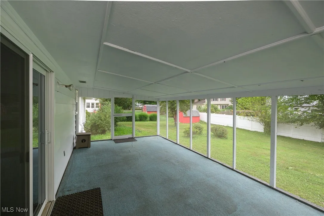 Unfurnished sunroom with healthy amount of natural light