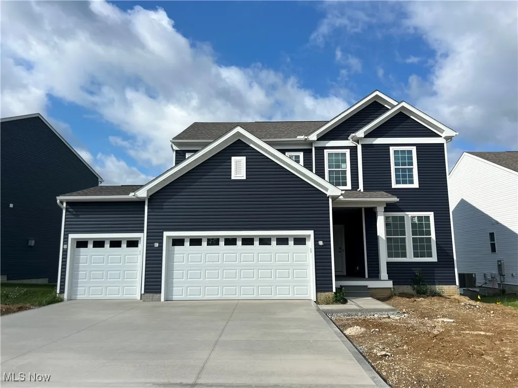Brand new construction with 3-car garage and landscaping TO BE INSTALLED.