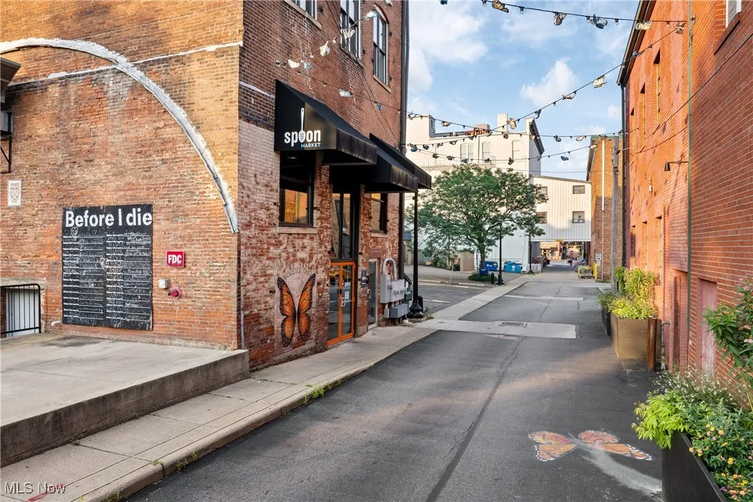 View of asphalt road with sidewalks