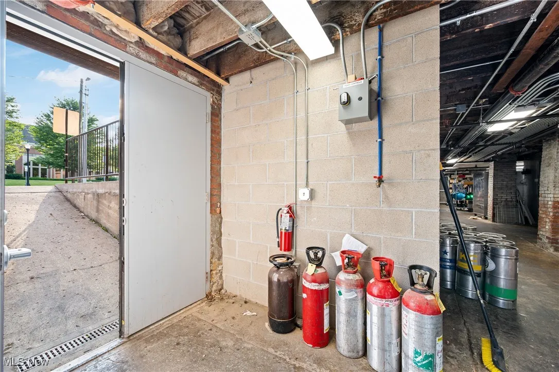 Basement featuring concrete block wall