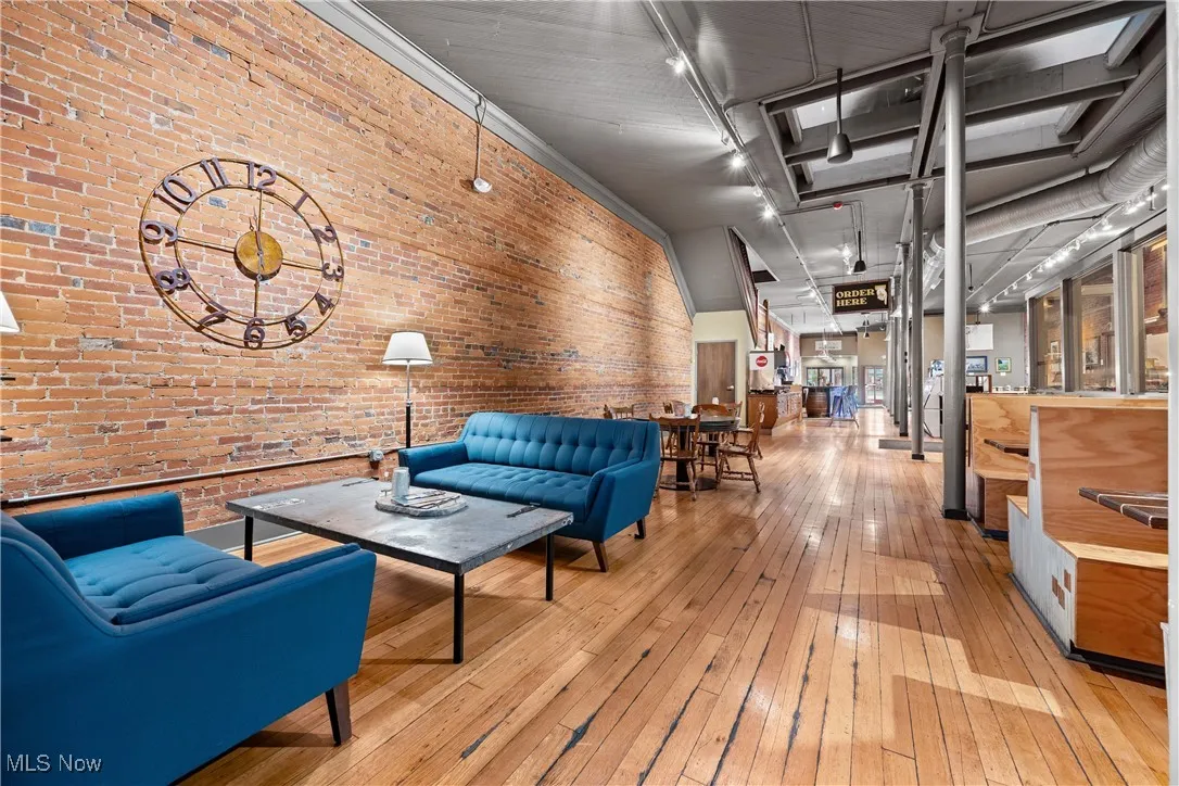 Common area with brick wall